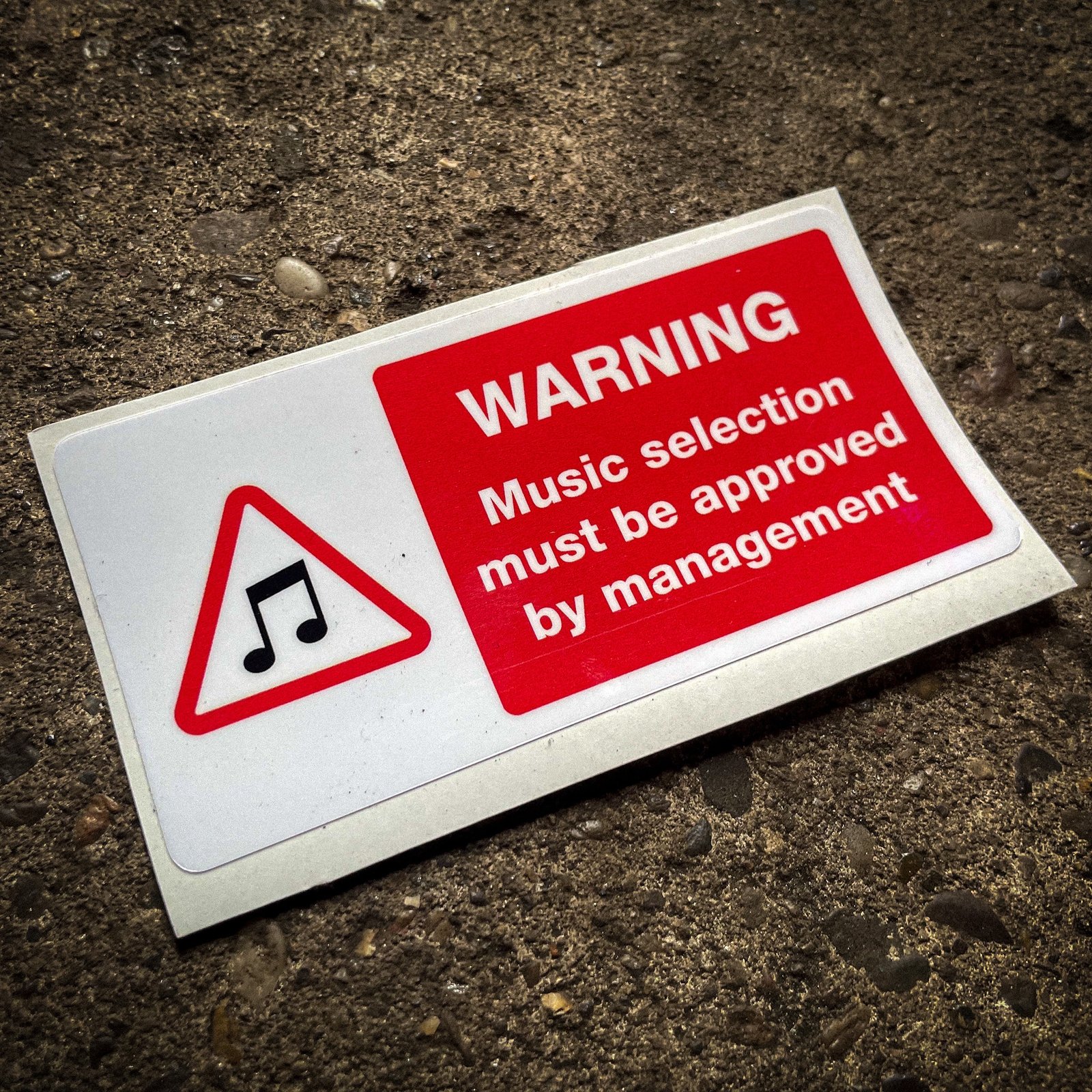 Funny "safety" sticker - WARNING: Music selection must be approved by management