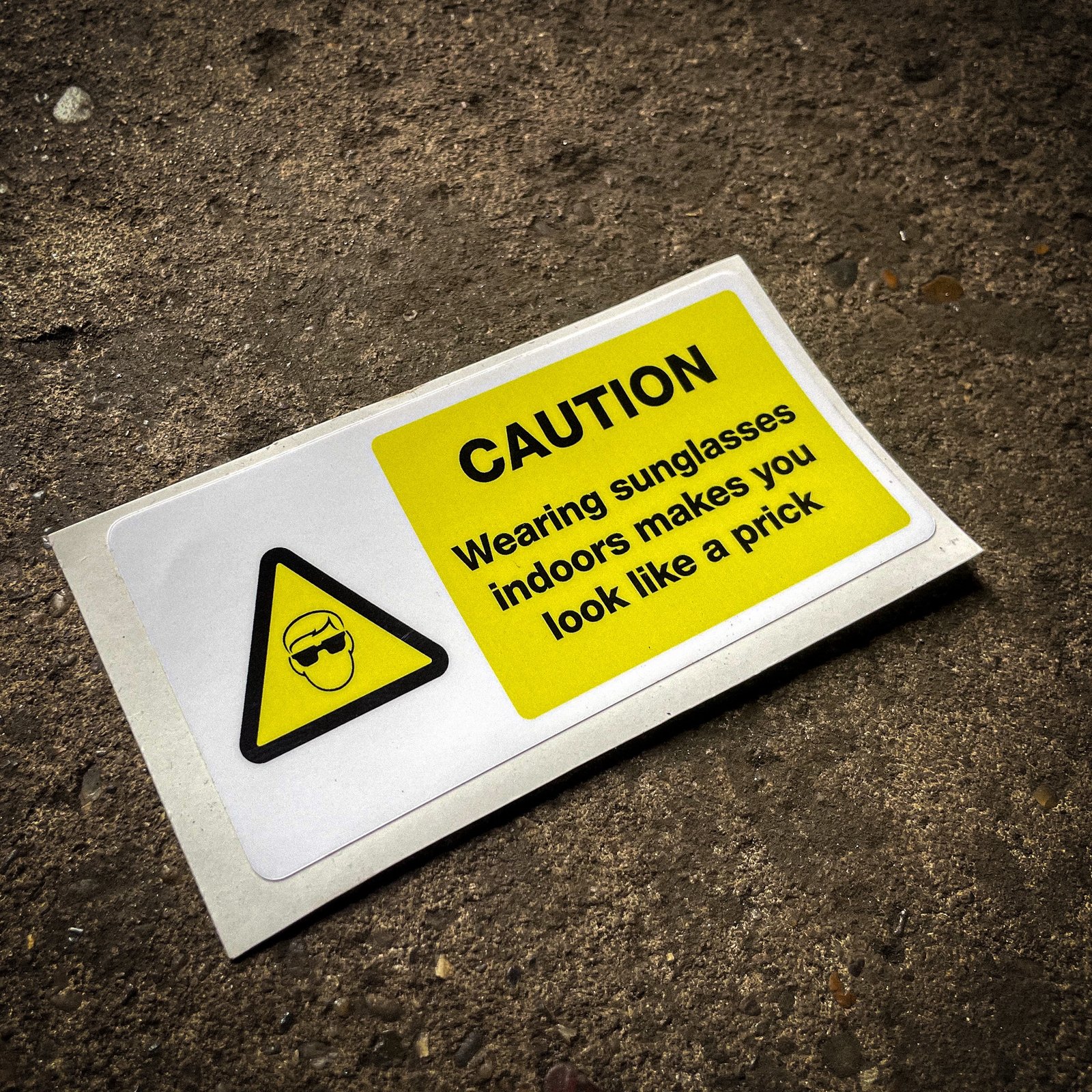 Funny "safety" sticker - CAUTION: wearing sunglasses indoors makes you look like a prick
