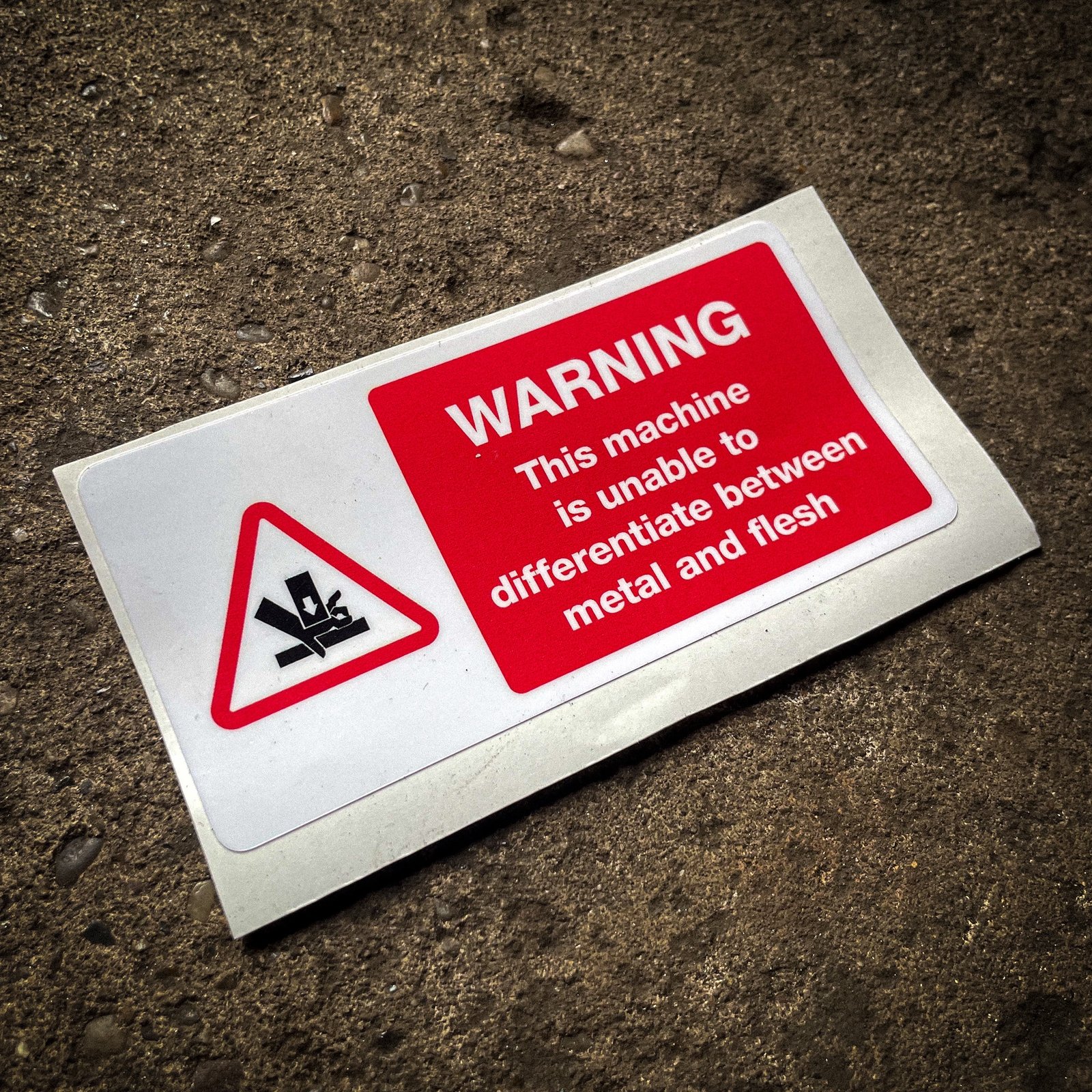 Funny "safety" sticker - WARNING: This machine is unable to differentiate between metal and flesh