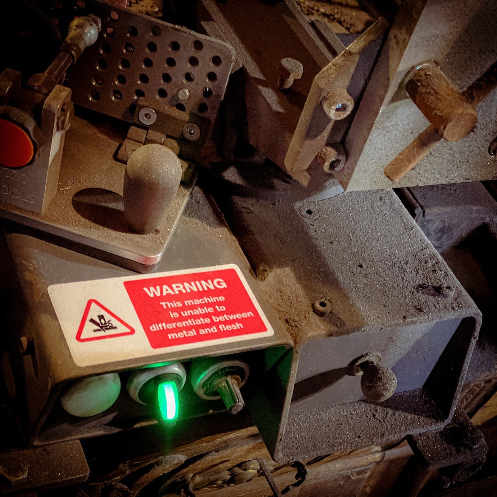 Funny "safety" sticker - WARNING: This machine is unable to differentiate between metal and flesh